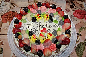 Beautiful holiday cake with berries and inscription