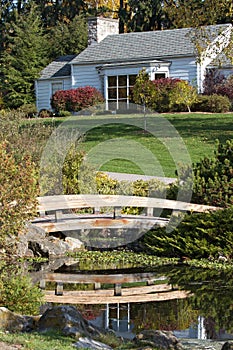 Beautiful home with footbridge over pond