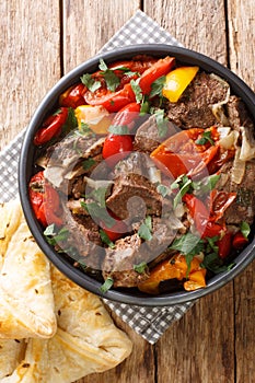 Beautiful Homemade Buglama or Lamb with Vegetables and Fragrant Herbs closeup in the Bowl top view