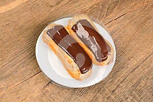 Beautiful homemade mini eclairs filled with vanilla and chocolate custard.