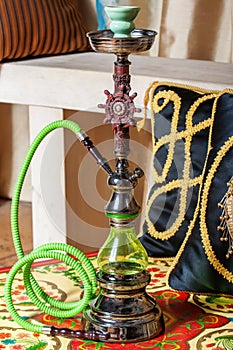 Beautiful hookah standing on a table in the eastern interior