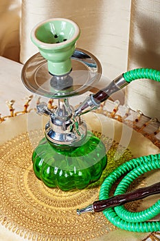 Beautiful hookah standing on a table in the eastern interior