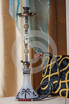 Beautiful hookah standing on a table in the eastern interior
