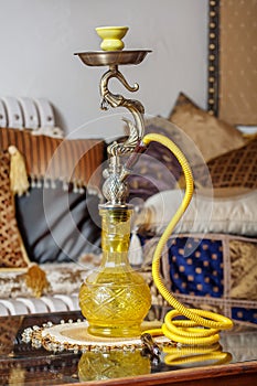 Beautiful hookah standing on a table in the eastern interior