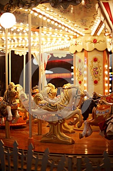 Beautiful horse Christmas carousel. Merry-go-round with horses