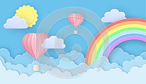 Beautiful hot air balloons flying over fluffy clouds in the sky with sun and rainbow. Greeting card for Valentine\'s Day