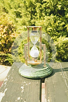 Beautiful hourglass stand against the background of beautiful nature