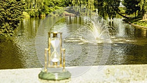 Beautiful hourglass stand against the background of beautiful nature