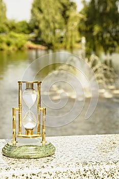 Beautiful hourglass stand against the background of beautiful nature