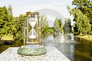 Beautiful hourglass stand against the background of beautiful nature