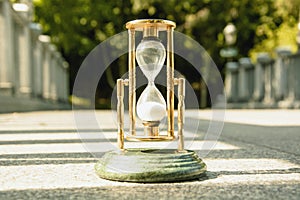 Beautiful hourglass stand against the background of beautiful nature