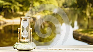 Beautiful hourglass stand against the background of beautiful nature