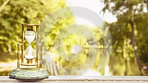 Beautiful hourglass stand against the background of beautiful nature