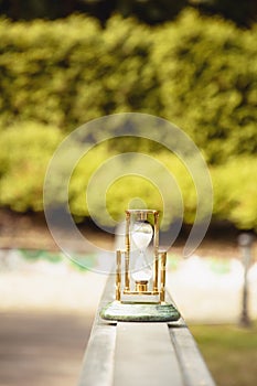 Beautiful hourglass stand against the background of beautiful nature