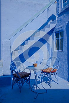 Beautiful house in chefchouen, the city known for his colorful streets and walls. Blue door, entrance of cozy house photo