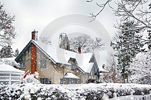 Beautiful house covered snow located in the Queen Street, Niagara on the Lake. Ontario, Canada