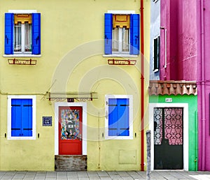 Beautiful house door and wall colors on the island of Burano Italy photo