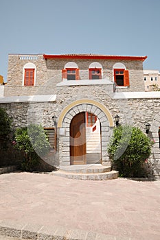 Beautiful house exterior with shrubbery on sunny day