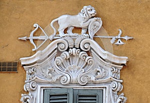 Beautiful house facade with carved stone animals in Mantua, Italy