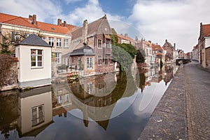 Beautiful houses along the canals of Brugge, Belgium. Tourism destination in Europe