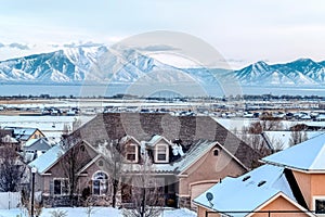 Beautiful houses in a peaceful neighborhood with mountain and cloudy sky views