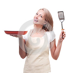 Beautiful housewife with spatula. Isolated on white background