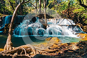 Beautiful of Huai mae khamin waterfall Srinakarin national park at Kanchanaburi thailand. Waterfall clear emerald water on autumn