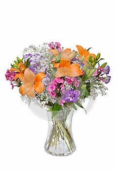 Beautiful huge bouquet of bulbous lily and lisianthus in vase on white background