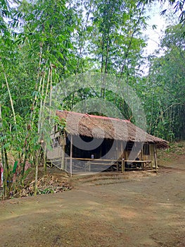beautiful huts beside the Cisadane river with bamboo architecture and under bamboo trees photo