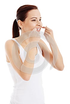 Beautiful hygiene woman with dental floss.