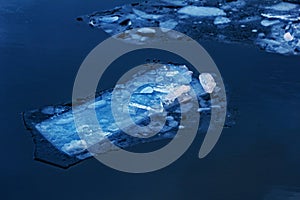 Beautiful ice floes in dark blue water