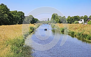 Beautiful idyllic Aa river landscape on the outskirts of dutch city - s-Hertogenbosch, Netherlands photo