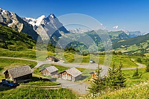 Beautiful idyllic mountains landscape with country house (chalet) in summer