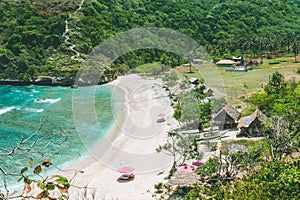 Beautiful idyllic white sand Atuh beach appealing for relax. Clear blue ocean waves rolling to the beach. Nusa Penida