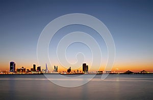 Beautiful illuminated buildings and Bahrain skyline