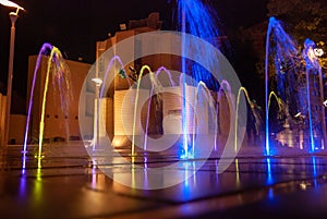 Beautiful illuminated colorful city fountain at night time