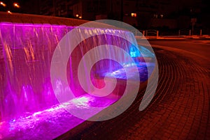 Beautiful illuminated colorful fountain at night time