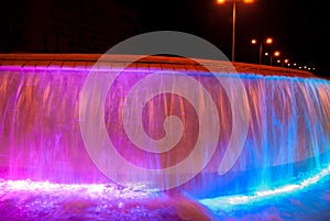 Beautiful illuminated colorful fountain at night time