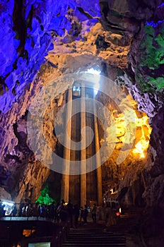 beautiful illuminated multicolored stalactites from karst Reed Flute cave. Guilin Guangxi China