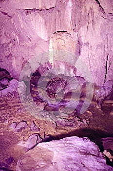 beautiful illuminated multicolored stalactites from karst Reed Flute cave. Guilin Guangxi China