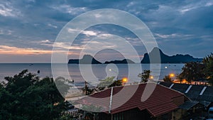 Beautiful illuminated shining in twilight at Prachuap port