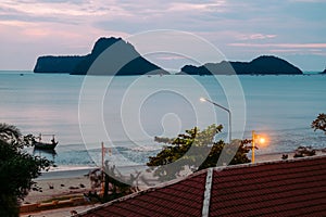 Beautiful illuminated shining in twilight at Prachuap port