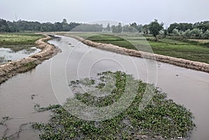 Beautiful image of little water canal in a village india