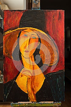 Beautiful Image Oil On Canvas. Portrait of a woman in a hat. Free copy based on the famous painting by Amedeo Modigliani