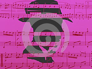 Beautiful image showing a pink music sheet of paper with a man`s profile in background!