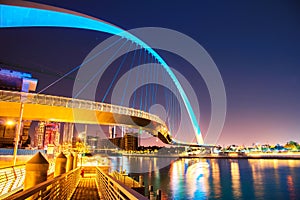 Beautiful incredible cityscape with Tolerance bridge near the water canal in Dubai, United Arab Emirates