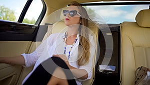 Beautiful independent woman enjoying car trip on vacation, business traveler photo