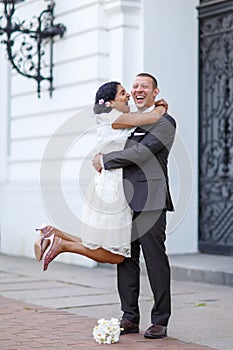 Beautiful indian bride and caucasian groom after wedding ceremon