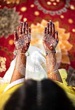 Beautiful Indian bride showing hands mehndi or henna design