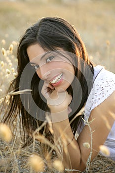 Beautiful indian brunette in a golden field